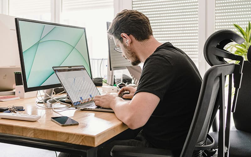 Person with neck pain at desk